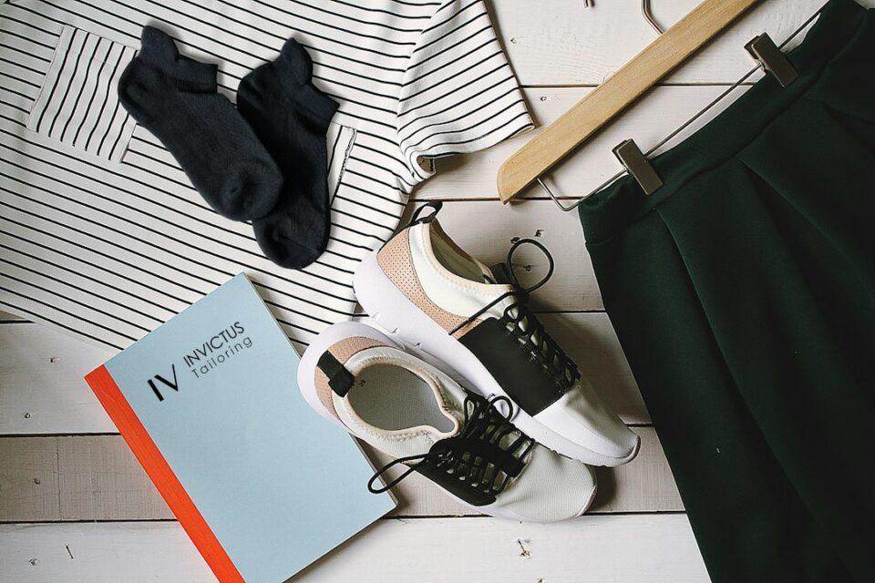 Workwear capsule wardrobe cover artwork featuring mix-and-match outfits in neutral tones
